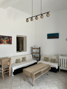 Cozy living room with sofa in the rented house Anneta in Pitsinianika, Kythera